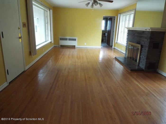 507 O'Hara Road Moscow, PA 18444 - Photo 6 of 13 a view of a livingroom with wooden floor and a ceiling fan