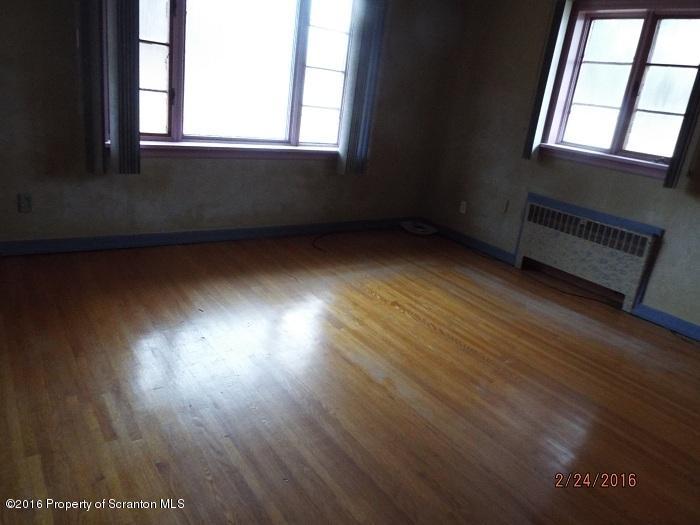 507 O'Hara Road Moscow, PA 18444 - Photo 7 of 13 an empty room with wooden floor and windows