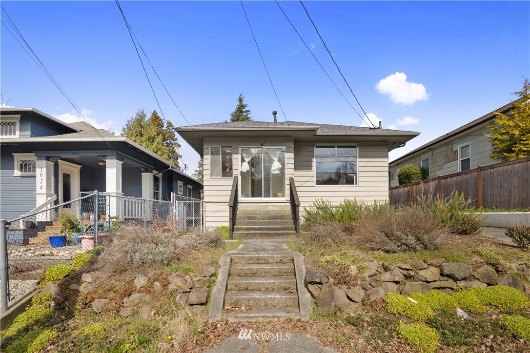 1706 North 50th Street Seattle, WA 98103 - Photo 2 of 18 a front view of a house with garden
