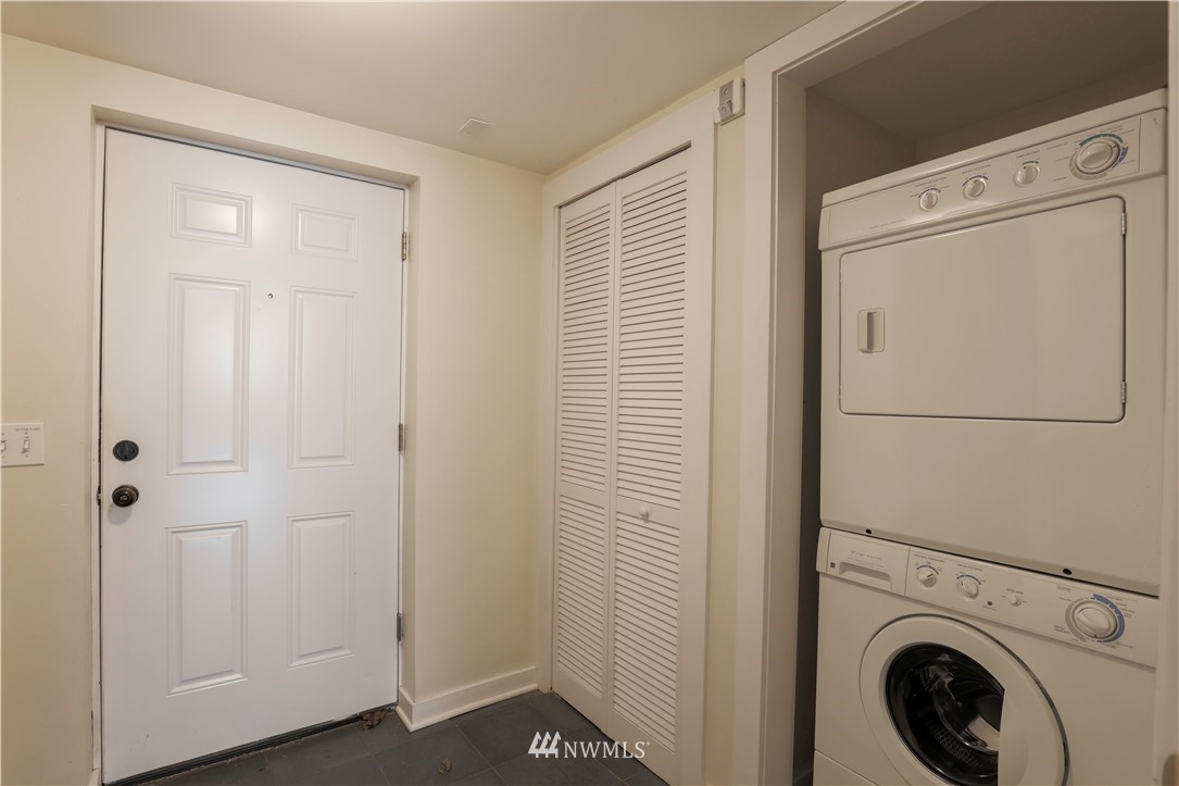 1706 North 50th Street Seattle, WA 98103 - Photo 11 of 18 a view of a storage & utility room with washer and dryer