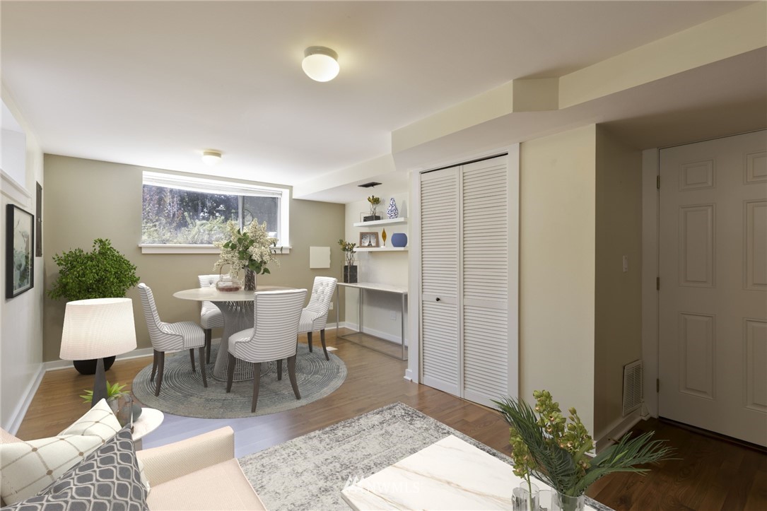 1706 North 50th Street Seattle, WA 98103 - Photo 13 of 18 a view of a dining room with furniture and wooden floor