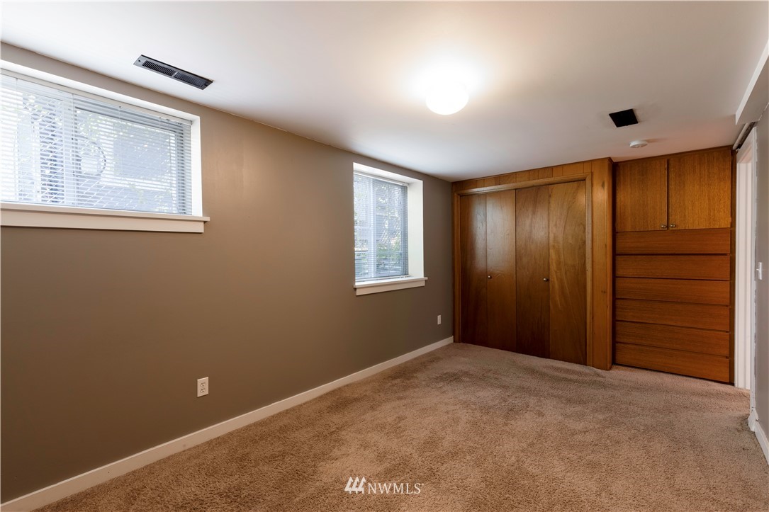 1706 North 50th Street Seattle, WA 98103 - Photo 14 of 18 a view of an empty room with a window