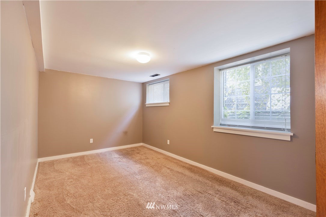1706 North 50th Street Seattle, WA 98103 - Photo 16 of 18 a view of an empty room with a window