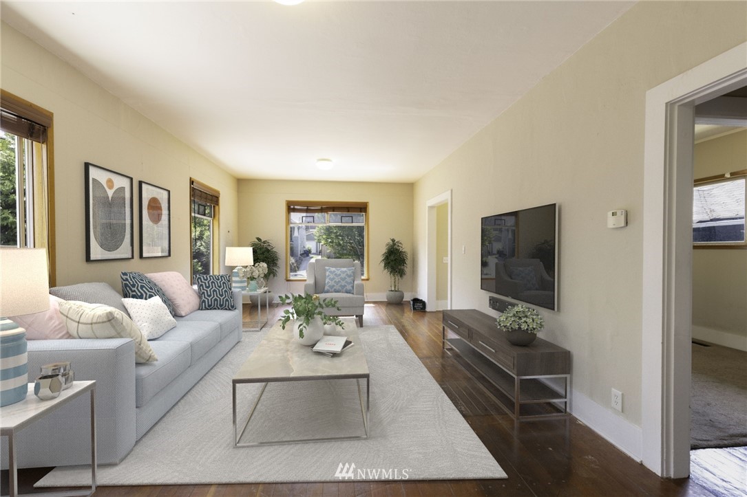 1706 North 50th Street Seattle, WA 98103 - Photo 5 of 18 a living room with furniture and a flat screen tv