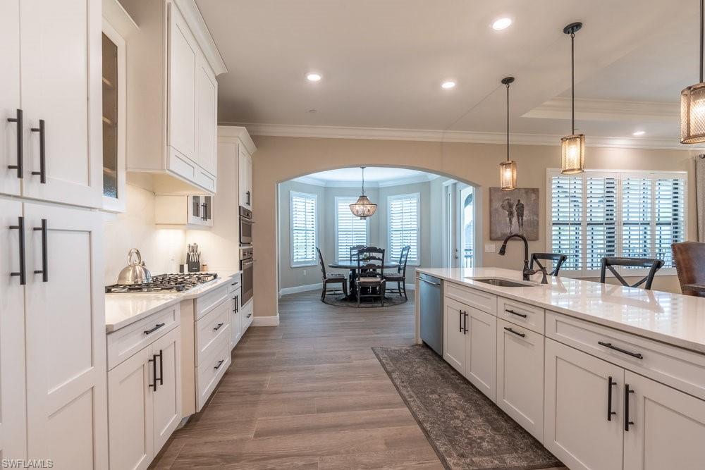16375 Viansa Way, Unit 102 Naples, FL 34110 - Photo 11 of 40 a kitchen with lots of counter space
