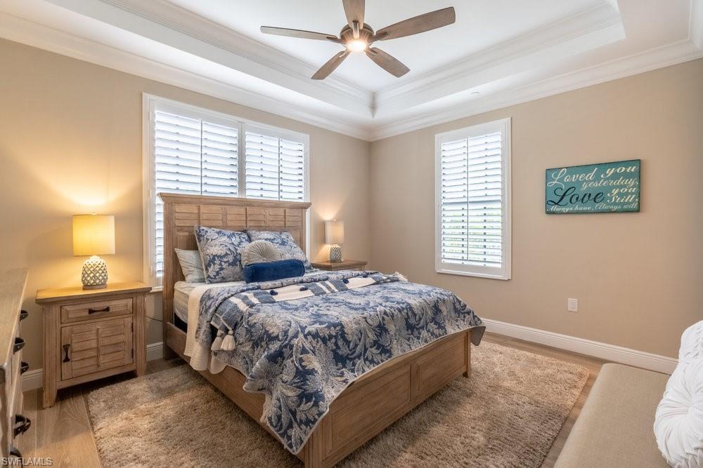 16375 Viansa Way, Unit 102 Naples, FL 34110 - Photo 18 of 40 a bedroom with a bed and a window