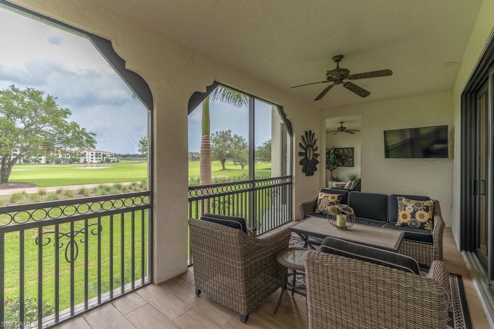 16375 Viansa Way, Unit 102 Naples, FL 34110 - Photo 29 of 40 a view of a porch with furniture and garden