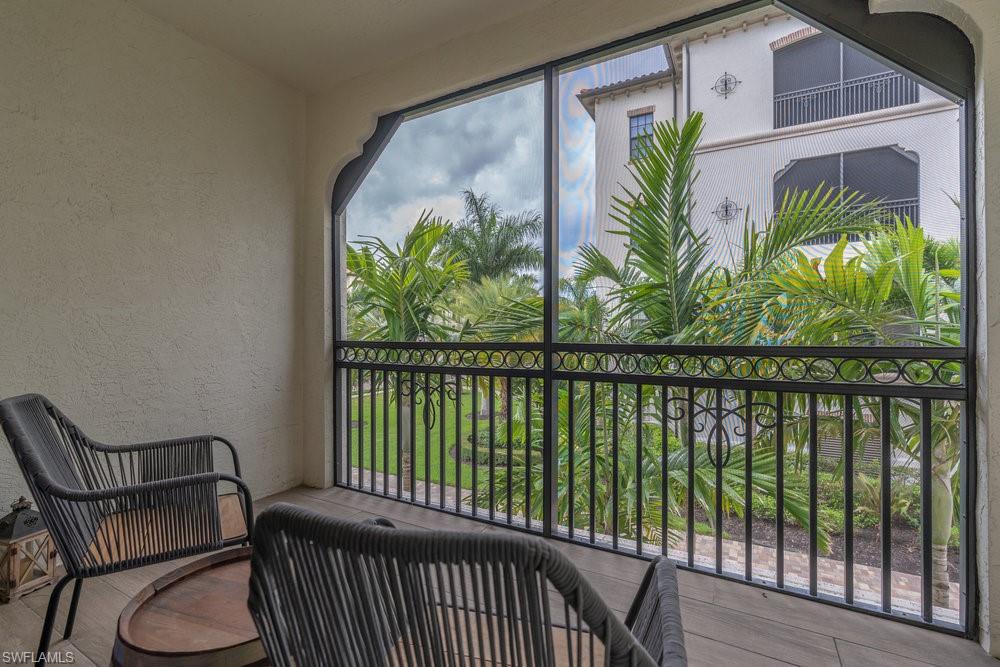 16375 Viansa Way, Unit 102 Naples, FL 34110 - Photo 31 of 40 a view of a balcony with furniture