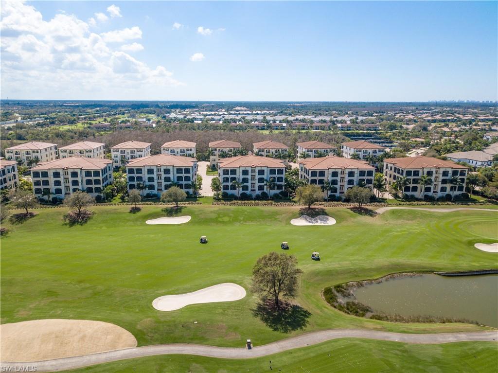 16375 Viansa Way, Unit 102 Naples, FL 34110 - Photo 32 of 40 a view of a city with lawn chairs