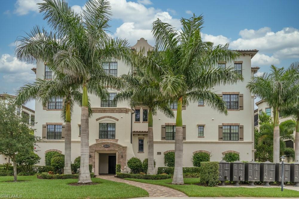 16375 Viansa Way, Unit 102 Naples, FL 34110 - Photo 33 of 40 a front view of house with yard and green space