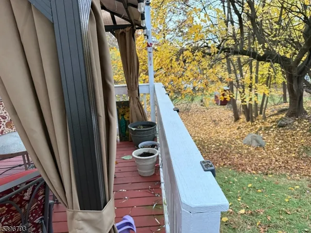 a view of balcony with furniture