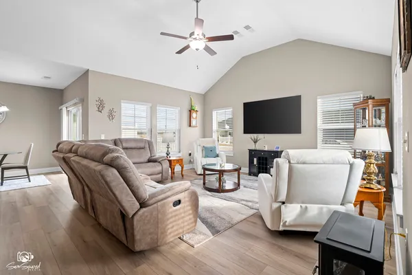 a living room with furniture and a flat screen tv