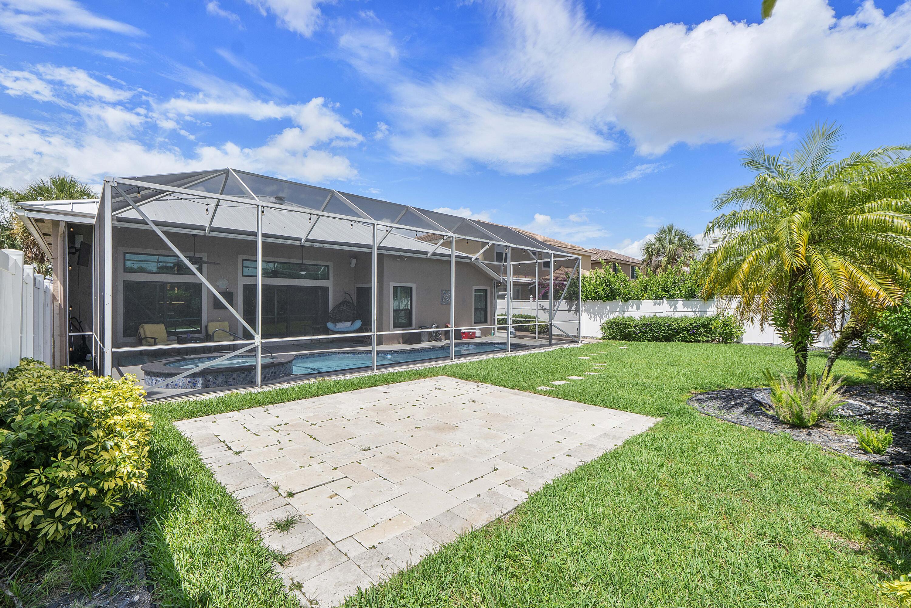 12328 St Simon Drive Boca Raton, FL 33428 - Photo 37 of 52 a view of a backyard with a garden and deck