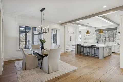 a kitchen with stainless steel appliances a sink stove and cabinets
