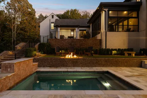 a view of a house with garden space and street view