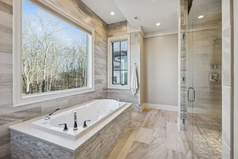a bathroom with a sink and a window