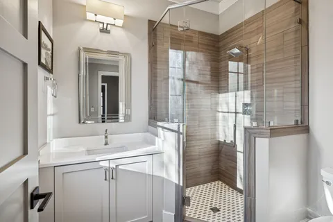 a view of a bathroom with a sink and a mirror