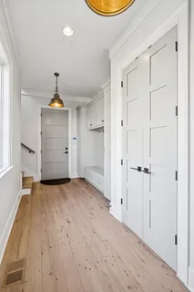 a bathroom with a double vanity sink and a mirror