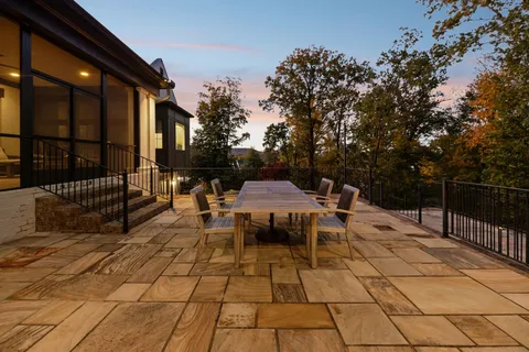 an aerial view of a house with a yard basket ball court and outdoor seating