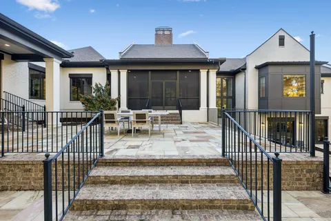 an outdoor space with seating area and garden