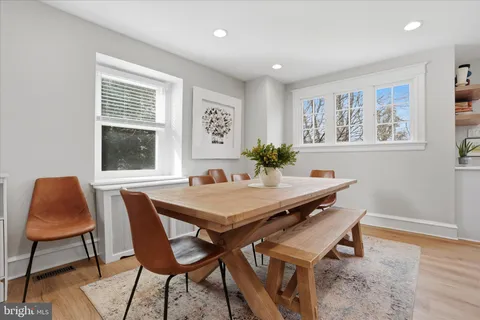 a view of a dining room with furniture and window