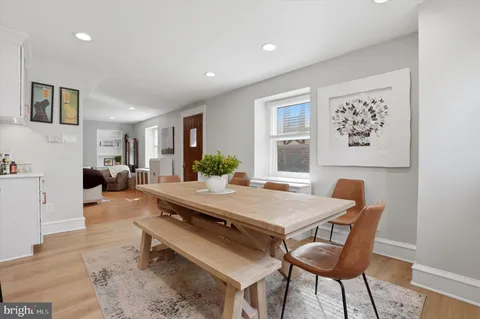 a view of a dining room with furniture and window