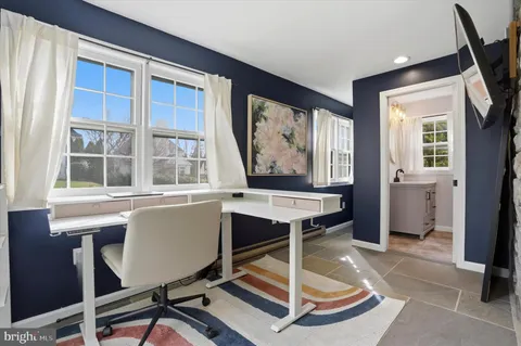 a workspace with furniture and window