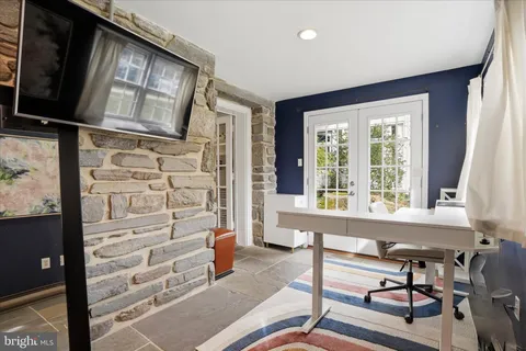 a view of a livingroom with furniture and a window