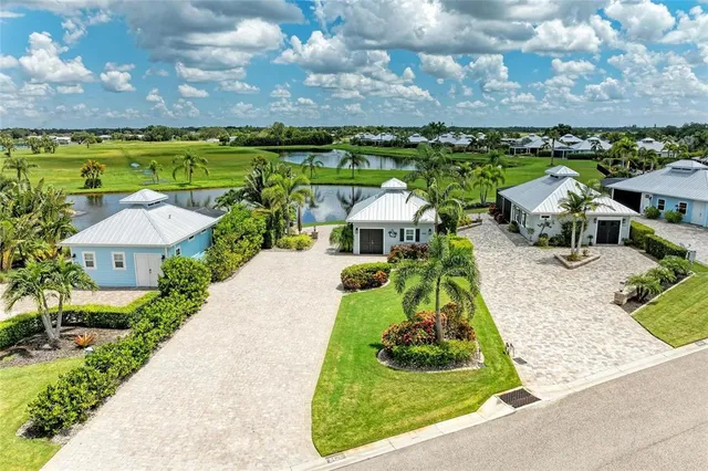 an aerial view of a house with garden space and street view