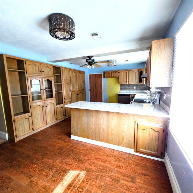 285 Montgomery Road Mineral Wells, TX 76067 - Photo 12 of 26 a view of a living room and kitchen with a large window