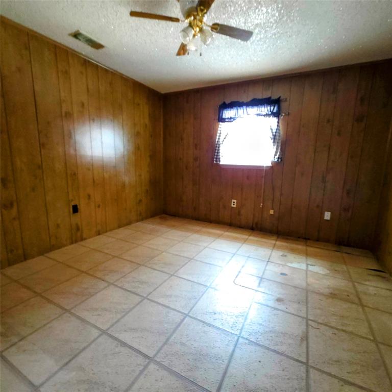 285 Montgomery Road Mineral Wells, TX 76067 - Photo 19 of 26 a view of an empty room with a window