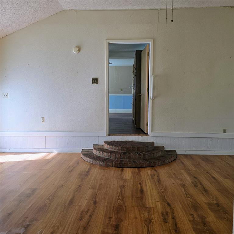 285 Montgomery Road Mineral Wells, TX 76067 - Photo 20 of 26 a bedroom with a bed and a dresser