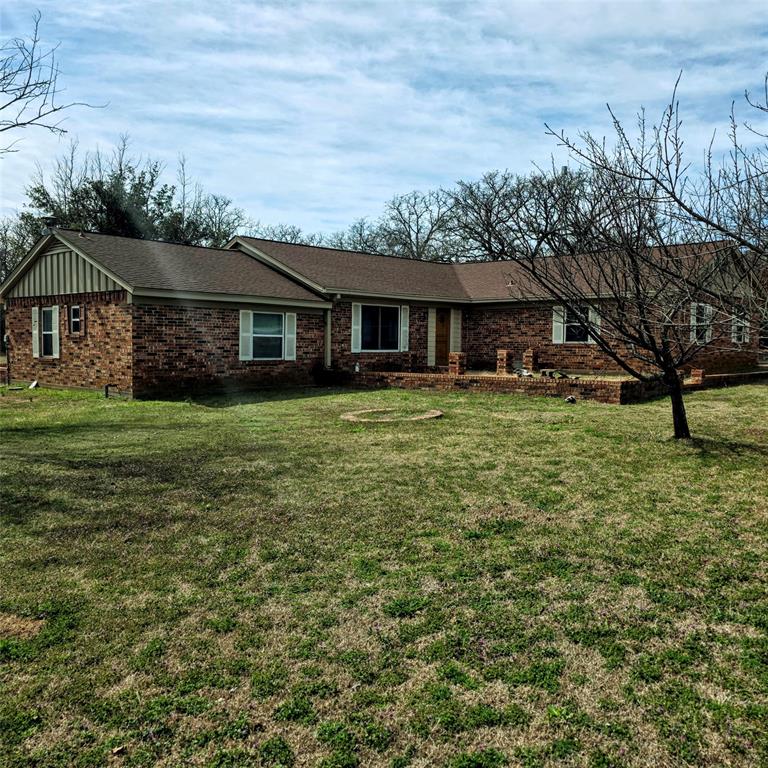 285 Montgomery Road Mineral Wells, TX 76067 - Photo 21 of 26 a view of a yard in front of the house