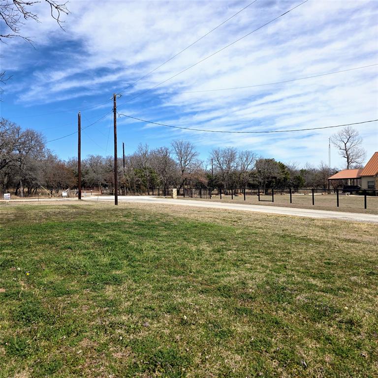 285 Montgomery Road Mineral Wells, TX 76067 - Photo 25 of 26 a view of a golf course with a lake
