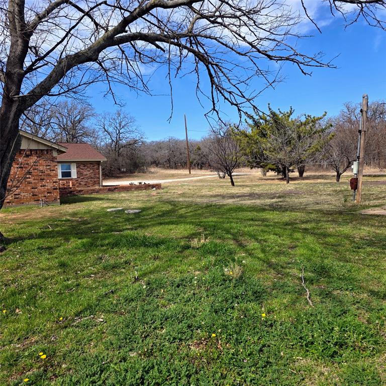 285 Montgomery Road Mineral Wells, TX 76067 - Photo 26 of 26 a swimming pool with an outdoor space and seating