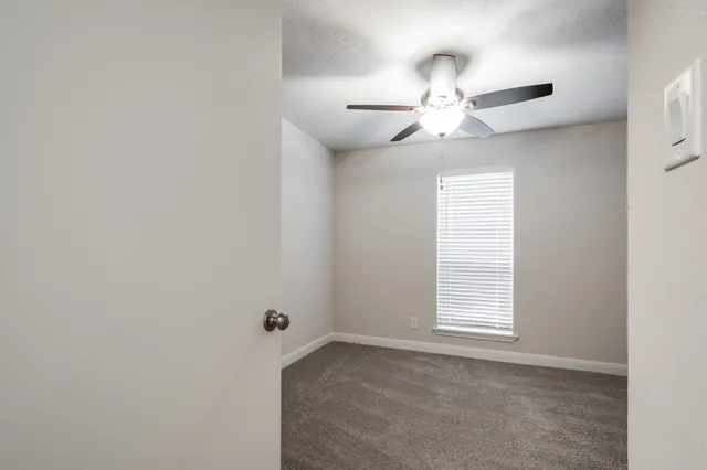 wooden floor in ceiling fan and window