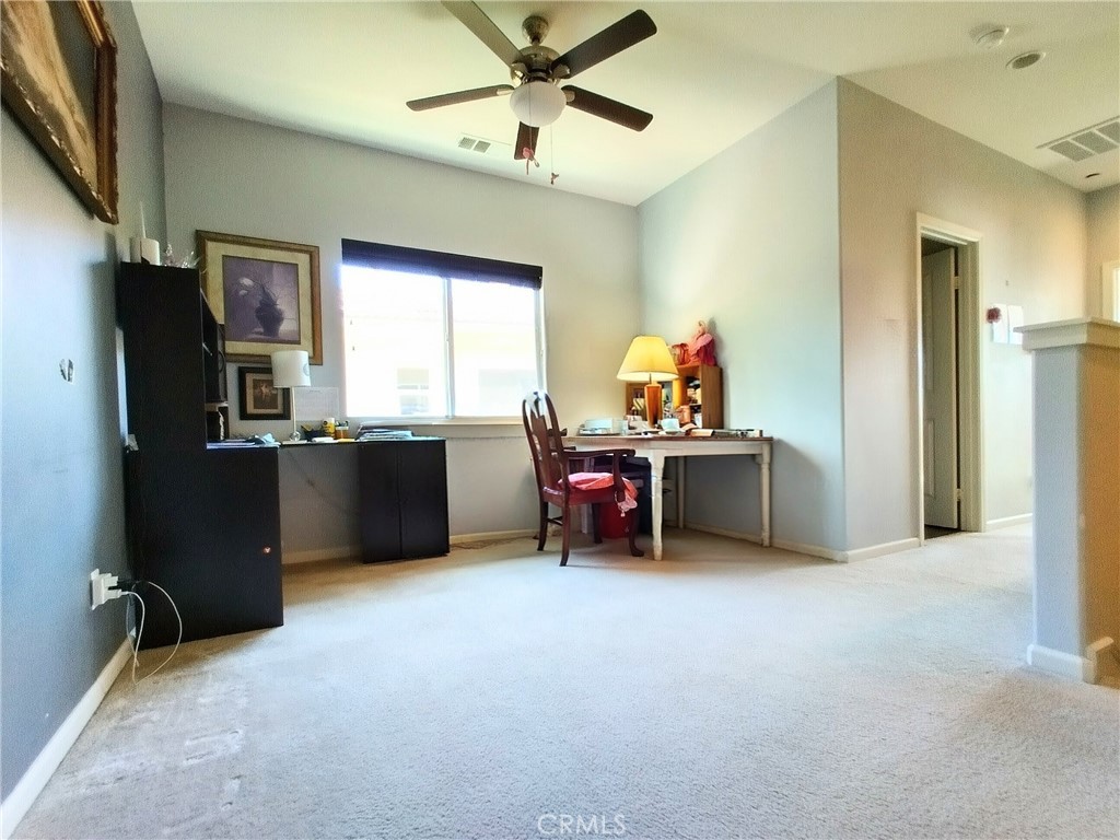 11811 Cramer Road Yucaipa, CA 92399 - Photo 47 of 56 a view of a workspace with furniture and a window