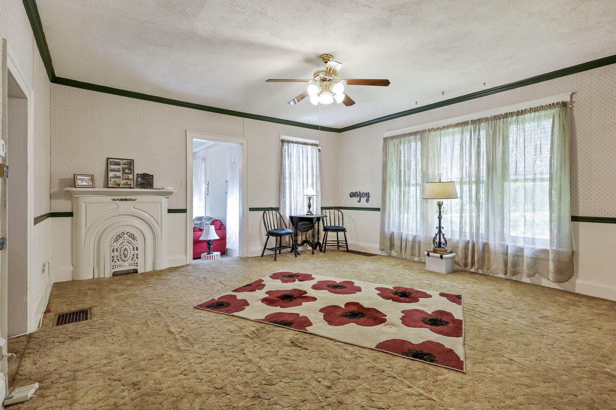 1625 Stringtown Road Northeast Lancaster, OH 43130 - Photo 17 of 61 Spacious dining room with chair rail and decorative fireplace.