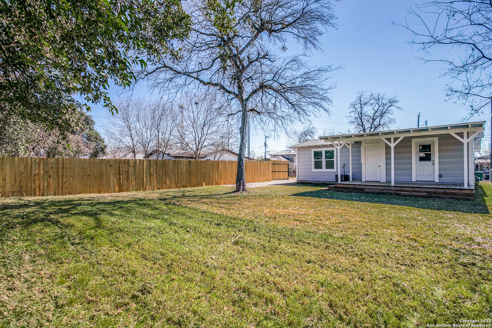311 Clarence Street San Antonio, TX 78212 - Photo 17 of 23 a view of a house with a backyard