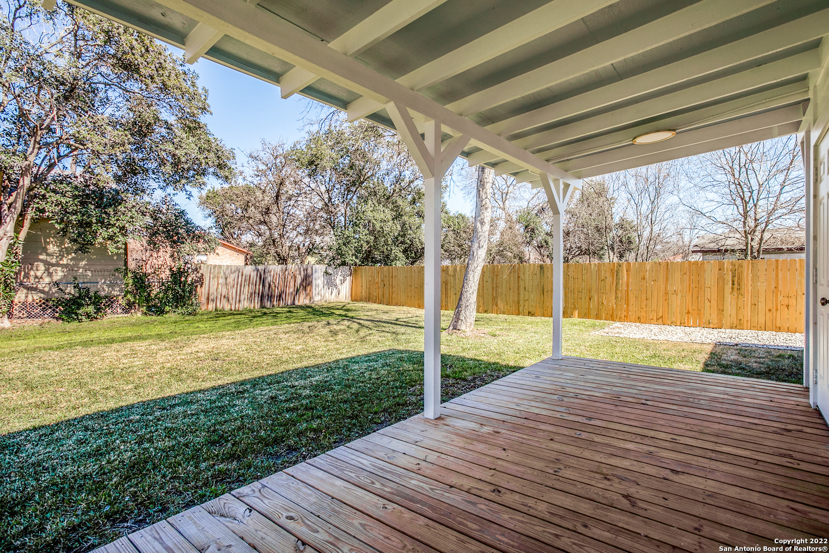 311 Clarence Street San Antonio, TX 78212 - Photo 22 of 23 a view of swimming pool with a yard and wooden fence