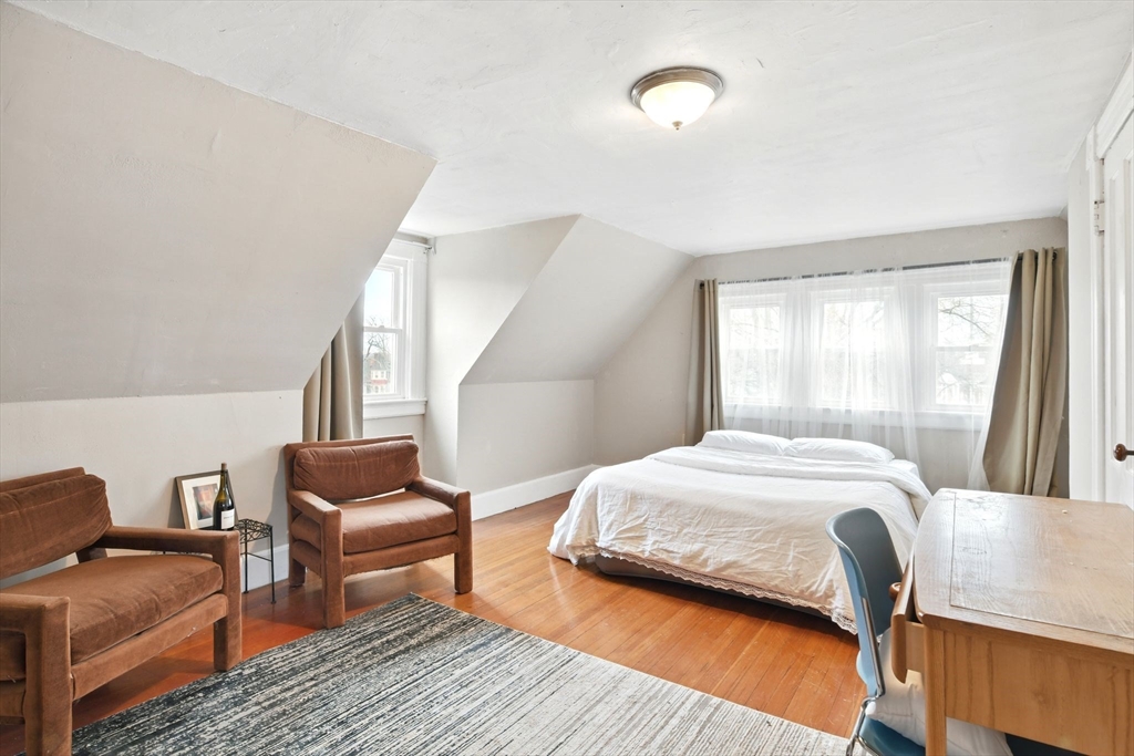 346 Maple Street Springfield, MA 01105 - Photo 19 of 36 a bedroom with furniture and a window