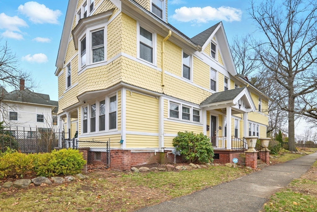 346 Maple Street Springfield, MA 01105 - Photo 2 of 36 a front view of a house with a yard