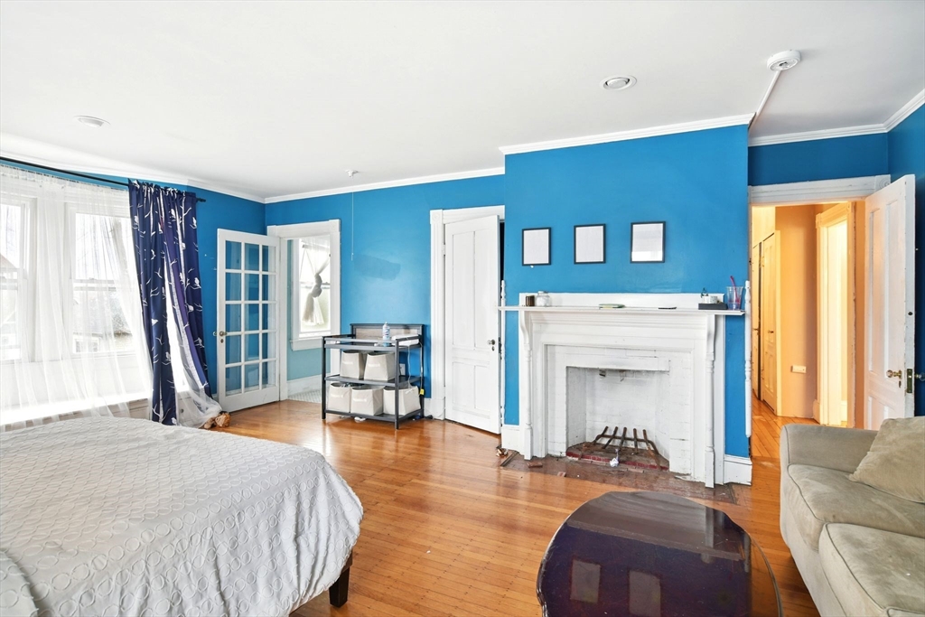 346 Maple Street Springfield, MA 01105 - Photo 22 of 36 a living room with furniture and a fireplace