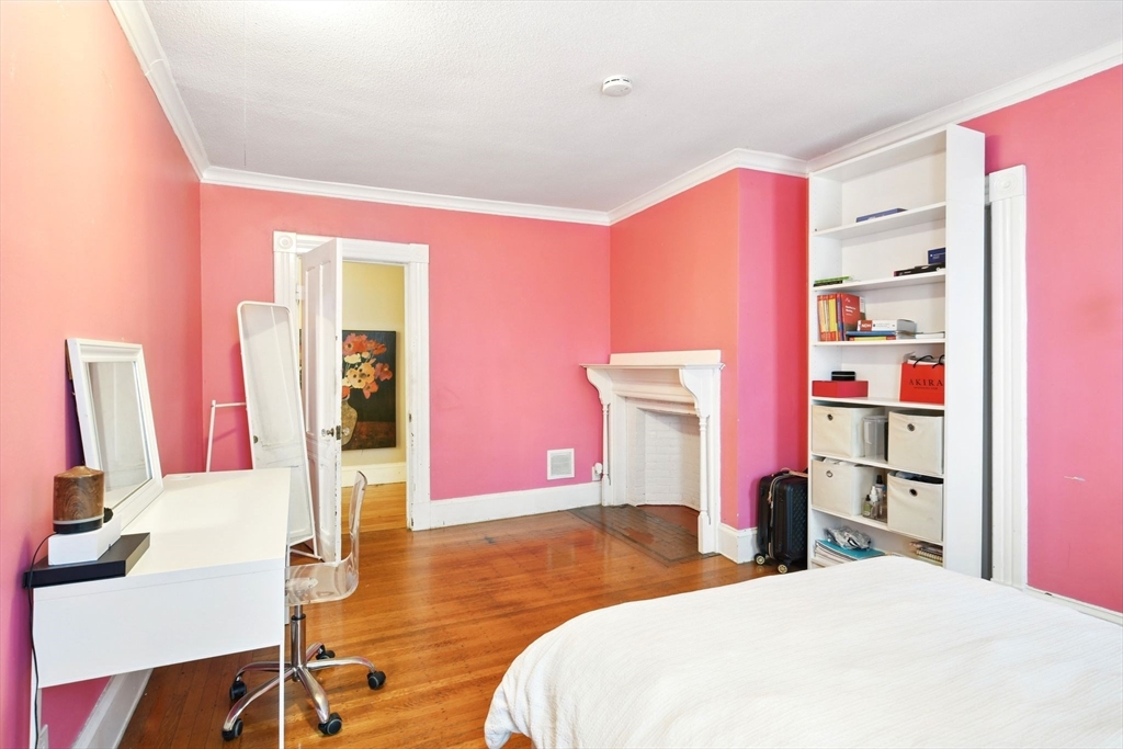 346 Maple Street Springfield, MA 01105 - Photo 26 of 36 a bedroom with a bed and a flat screen tv