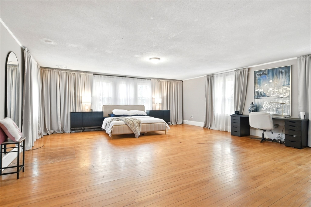 346 Maple Street Springfield, MA 01105 - Photo 28 of 36 a bedroom with a bed and large window