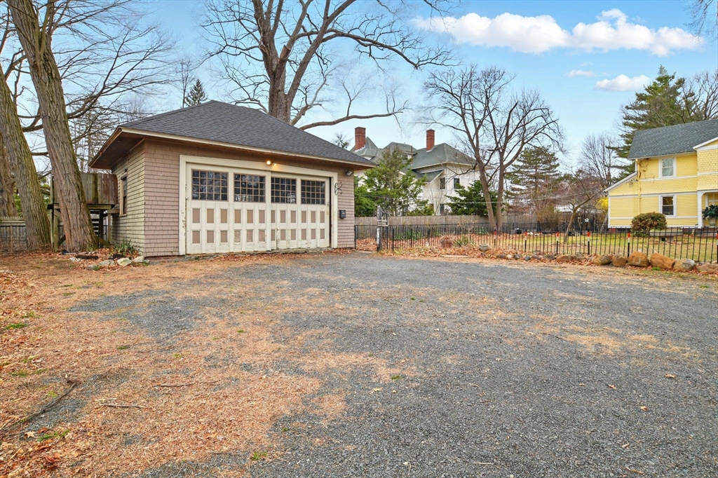 346 Maple Street Springfield, MA 01105 - Photo 35 of 36 a view of a house with a yard covered in snow