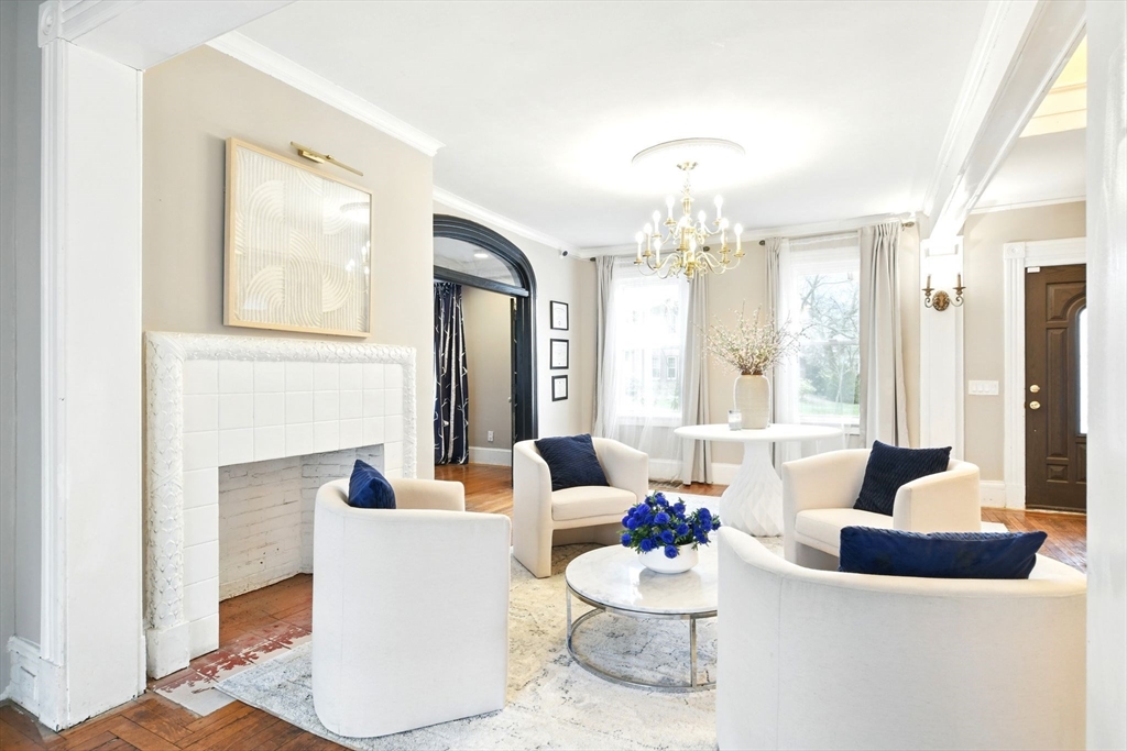 346 Maple Street Springfield, MA 01105 - Photo 6 of 36 a living room with fireplace furniture and a large window