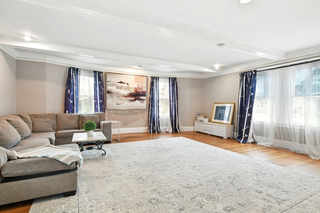 346 Maple Street Springfield, MA 01105 - Photo 9 of 36 a living room with furniture and a large window
