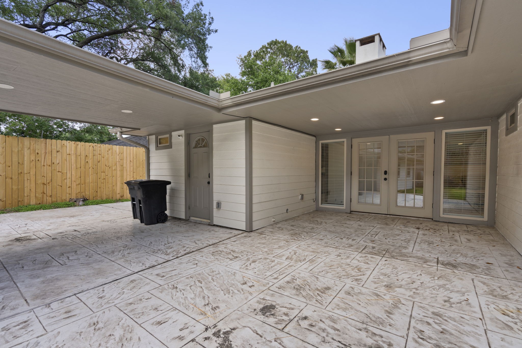 2402 Chimney Rock Road Houston, TX 77057 - Photo 31 of 36 French doors lead to a large covered patio—perfect for entertaining.