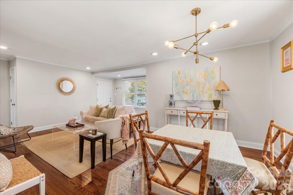 4922 Valley Stream Road Charlotte, NC 28209 - Photo 11 of 33 a view of a dining room with furniture and wooden floor